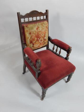 A Victorian walnut open armchair