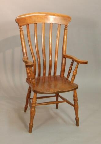 A Victorian lathe back armchair