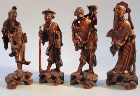 Four various Chinese Qing period hardwood carved figures