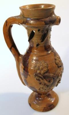 An 18thC English pottery puzzle jug - 2