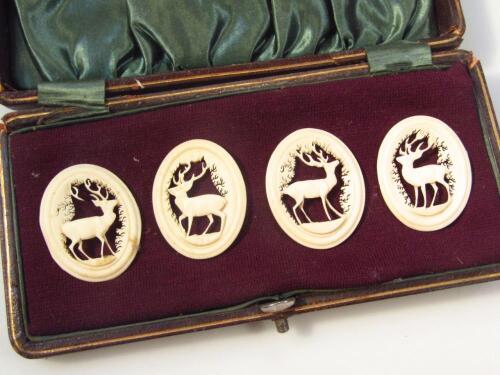 A matched set of four late 19thC carved bone ovals