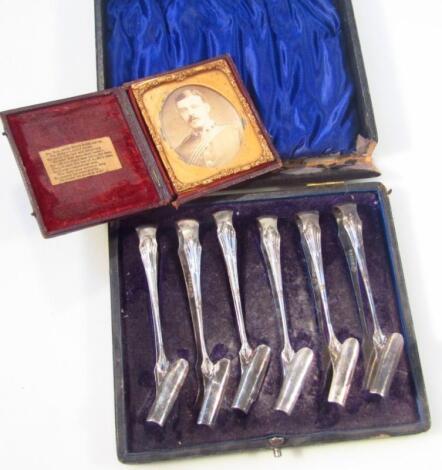 An unusual cased set of Edwardian silver plated tongs