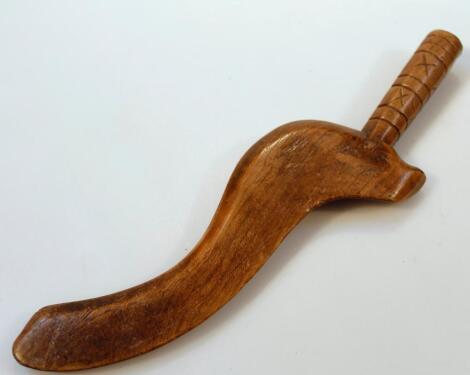 A 19thC shaped elm knitting stick with 'S' Scroll end and turned handle