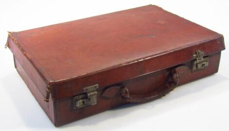 An early 20thC pressed leather travel case