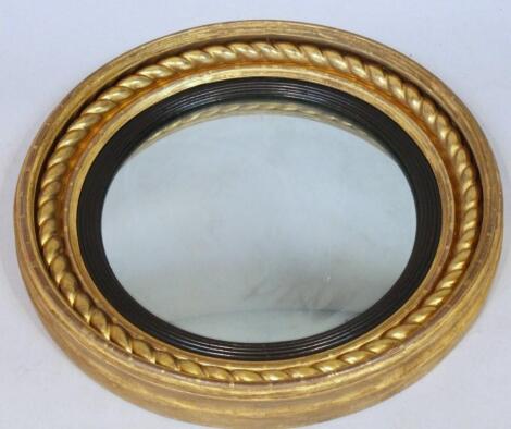 A mid-19thC gilt wood port hole mirror