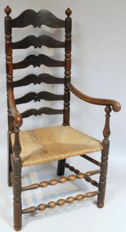 An early 19thC ash and elm country ladderback chair