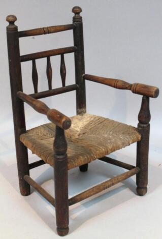 A 19thC ash and elm spindle back child's chair