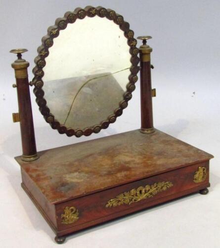 A 19thC French Empire style mahogany and gilt metal table mirror