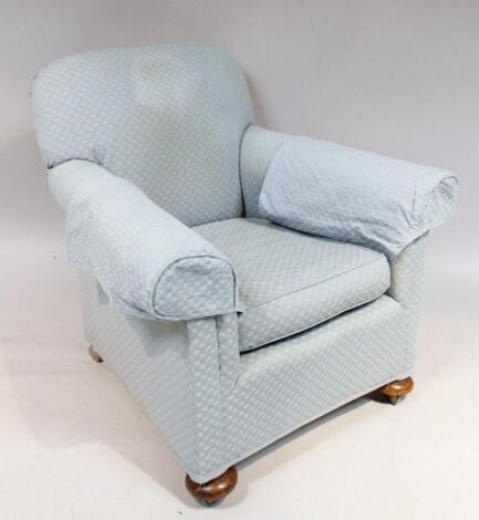 An Edwardian low armchair