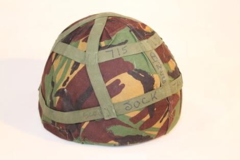 A 20thC NATO stock Mk 6 army camouflaged combat helmet