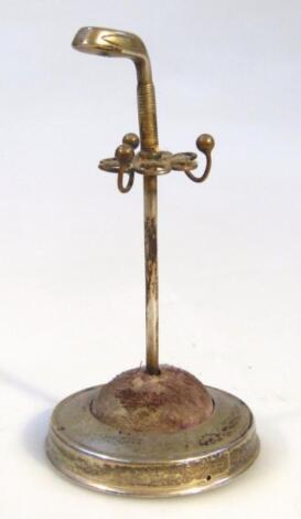 An Edwardian silver golfing related stick pin stand