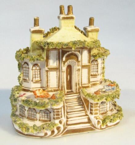 A 19thC Staffordshire pottery cottage group