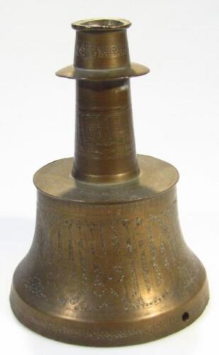 A Fars Khorasan style engraved brass candlestick