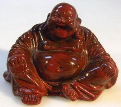 A Chinese late Qing period polished glass figure of Buddha