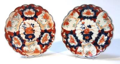 A pair of Japanese Imari pottery plates