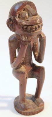 A heavily carved African tribal hardwood figure - 4