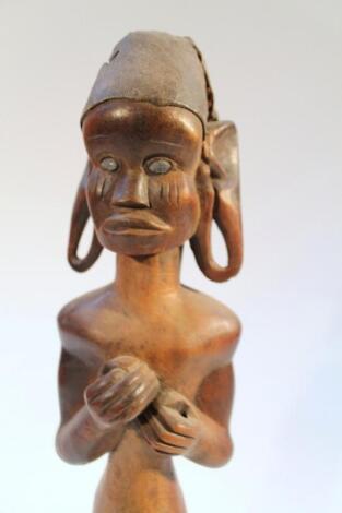 A heavily carved African figure