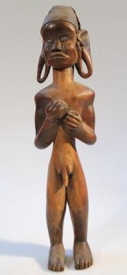 A heavily carved African figure - 2