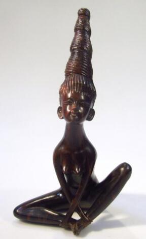 A heavily carved hardwood figure