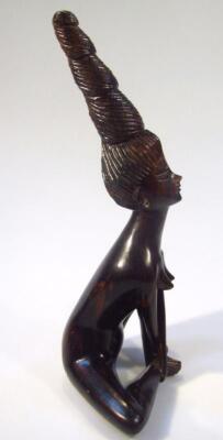 A heavily carved hardwood figure - 4
