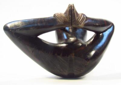 A heavily carved hardwood figure - 5