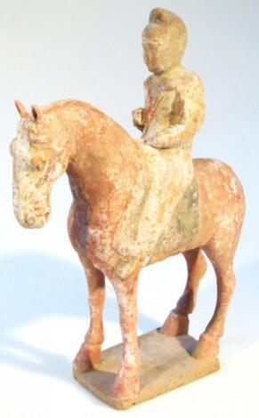 A Chinese Tang style figure group of a gentleman on horseback