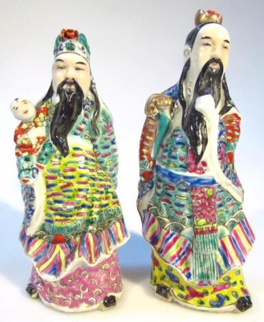 A pair of Chinese pottery famille jaune figures of bearded sages