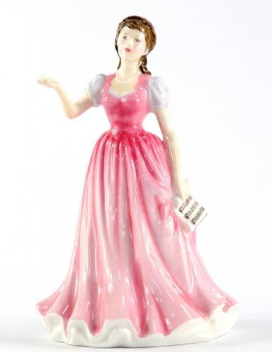 A Royal Doulton figure modelled as Sweet Music