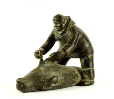 An Inuit serpentine carving of an eskimo