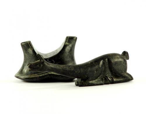 An Inuit serpentine carving of two eskimos