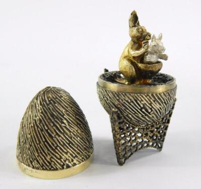 Stuart Delvin. A decorative silver egg and stand