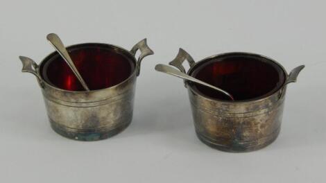 A pair of plated salt cellars