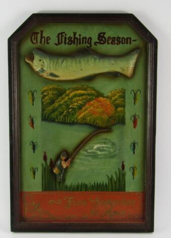 A carved wooden fishing plaque