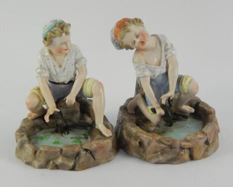 A pair of Ernst Bohne & Sohne porcelain figural match strikers