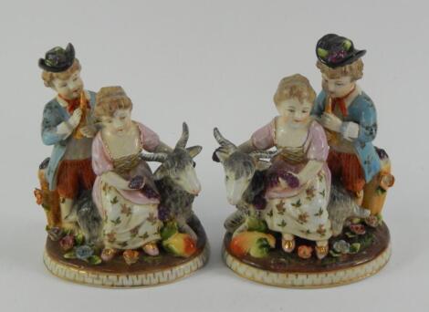 A pair of Continental porcelain figure groups