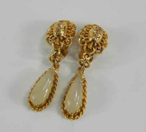 A pair of yellow metal and moonstone teardrop clip earrings