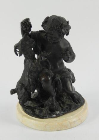 A bronze figure of a putto