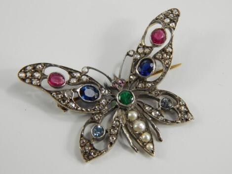 A yellow metal diamond and gem set butterfly brooch