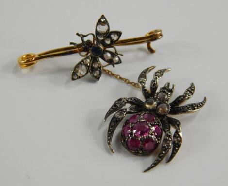 A yellow metal diamond and gem set insect bar brooch