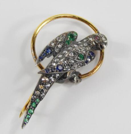 A diamond and gem set yellow metal brooch of a parakeet