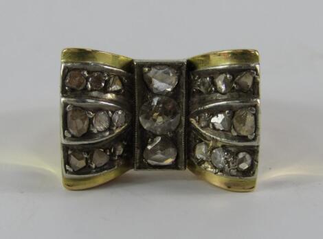 A yellow metal and diamond dress ring