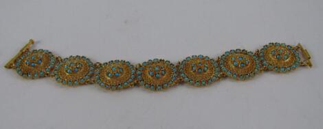 An Iranian yellow metal and turquoise bracelet