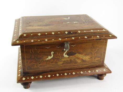 An Indian hardwood and inlaid casket