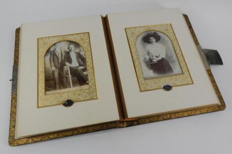 A Victorian red morocco bound photograph album