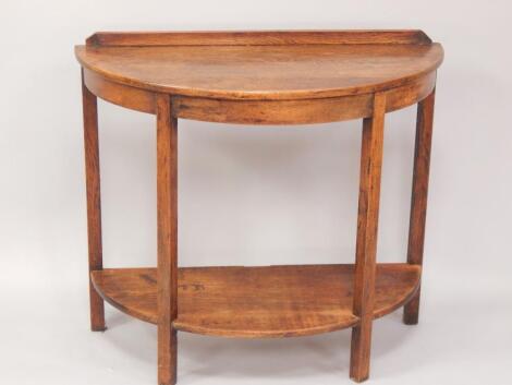 An oak demi lune side table