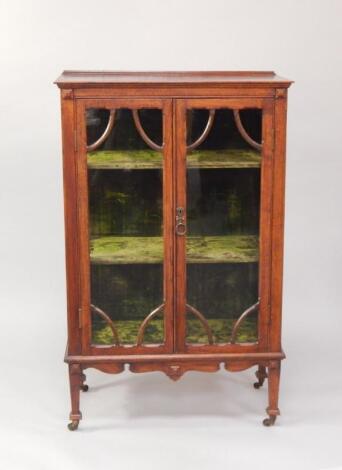 A mid Victorian oak display cabinet