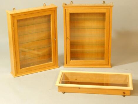 Two glazed oak wall mounted display cabinets