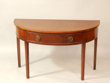 A mahogany and crossbanded demi lune table