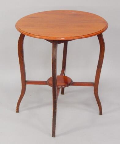 A Victorian circular mahogany two tier occasional table