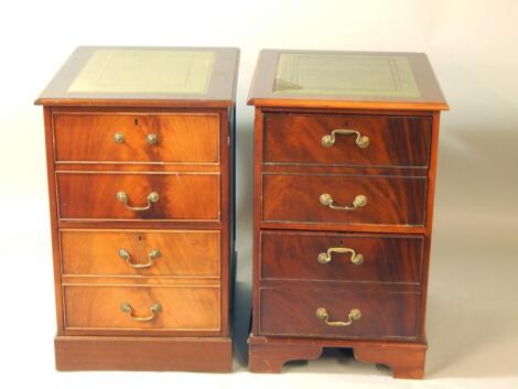 A pair of mahogany two drawer filing cabinets